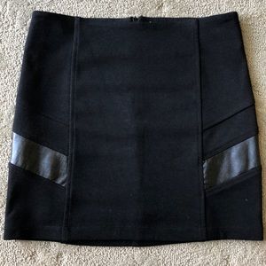 Versatile Abbeline Mini Skirt with Leather design!